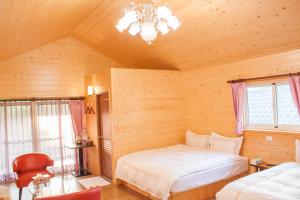 Postel nebo postele na pokoji v ubytování Xitou Star Homestay