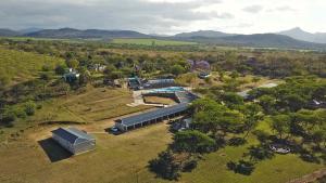 an aerial view of a house with a swimming pool at African Rest Lodge in Barberton