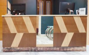 a wooden counter top in a room with at Petit Palace Canalejas Sevilla in Seville