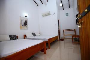 Voodi või voodid majutusasutuse Amadi Rest toas