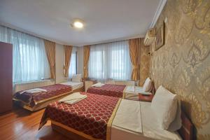 Postel nebo postele na pokoji v ubytování Hotel Akcinar