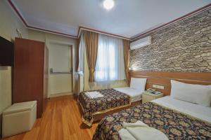 Postel nebo postele na pokoji v ubytování Hotel Akcinar