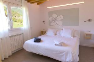 A bed or beds in a room at La Pomera