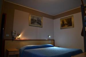 Postel nebo postele na pokoji v ubytování Hotel Miramonti
