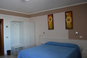 Postel nebo postele na pokoji v ubytování Hotel Miramonti