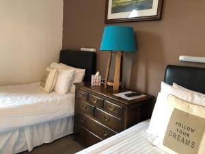 Postel nebo postele na pokoji v ubytování Westerlea Hotel Nairn