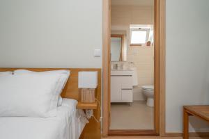 Postel nebo postele na pokoji v ubytování Peach Hostel & Suites