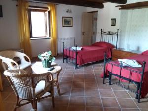 Postel nebo postele na pokoji v ubytování B&B Il Melograno