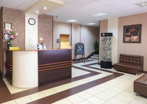 a woman sitting at a counter in a waiting room at Lovech Sport in Ryazan