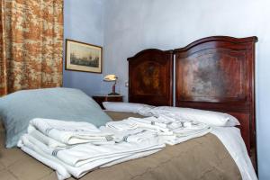 Postel nebo postele na pokoji v ubytování Al Porto Di Lucca B&B