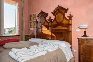 Postel nebo postele na pokoji v ubytování Al Porto Di Lucca B&B