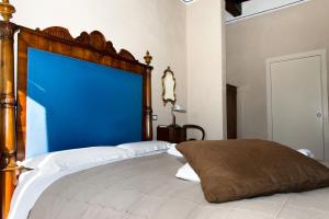 Postel nebo postele na pokoji v ubytování Al Porto Di Lucca B&B