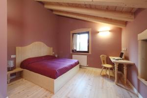 Postel nebo postele na pokoji v ubytování Zoncolan Apartments