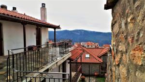 a balcony of a building with mountains in the background at Marianthi Apartments in Arachova