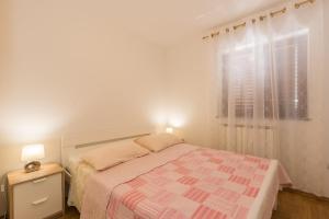 Postel nebo postele na pokoji v ubytování Apartments Villa Adria