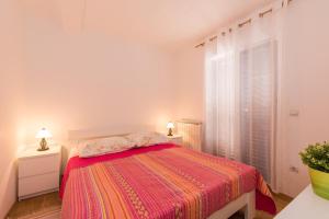 Postel nebo postele na pokoji v ubytování Apartments Villa Adria
