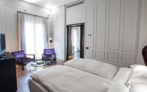 Postel nebo postele na pokoji v ubytování CoolRooms Palacio Villapanés 5 GL