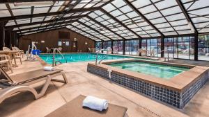 a large swimming pool with a glass ceiling at Best Western Paradise Inn in Dillon