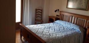 Postel nebo postele na pokoji v ubytování Casa Rural Tío Carlillos