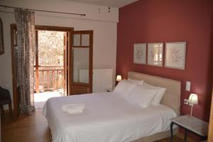 A bed or beds in a room at ZAROUCHLA INN