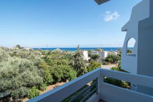 a balcony with a view of the ocean at Megim Hotel in Palaiochora