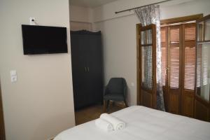 Postel nebo postele na pokoji v ubytování ZAROUCHLA INN