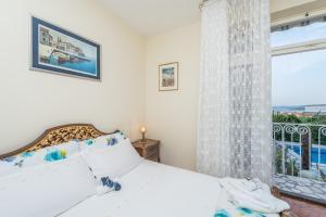 Giường trong phòng chung tại Villa Emilia +39 ảnh