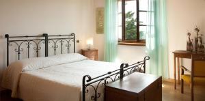 Katil atau katil-katil dalam bilik di Alloggio Agrituristico CORTE SAN BIAGIO