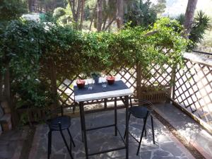 a table and two chairs on a patio at Villa Giannì in Palermo