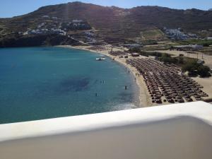 an aerial view of a beach with a group of chairs at Sea Side Studios & Houses in Kalo Livadi
