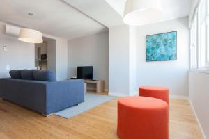 TV in/ali zabaviščno središče v nastanitvi FLH Principe Real Luxus Apartments