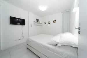 Cama ou camas em um quarto em Galinha d'Angola