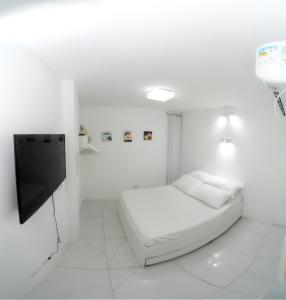 Cama ou camas em um quarto em Galinha d'Angola
