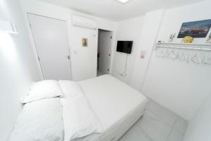 Cama ou camas em um quarto em Galinha d'Angola