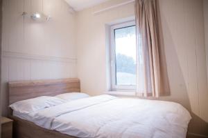 Postel nebo postele na pokoji v ubytování Pape Rogas