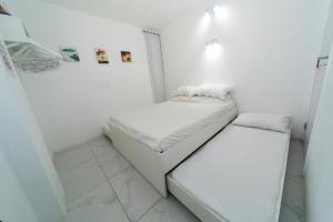 Cama ou camas em um quarto em Galinha d'Angola