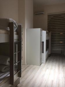 Postel nebo postele na pokoji v ubytování Travel Inn Hostel