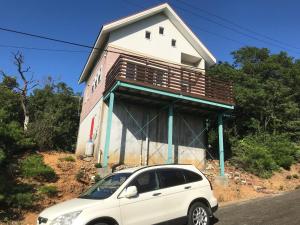 a white car parked in front of a house at Ise Sky Villa / Vacation STAY 2021 in Sōchi