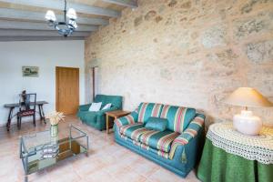 a living room with a couch and a table at Villa Agina in Algaida