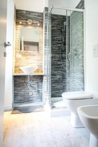 a bathroom with a shower and a sink and a toilet at La Casa di Celeste in Ossuccio +69 photos