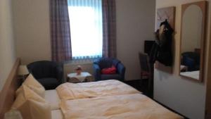 Postel nebo postele na pokoji v ubytování Hotel Goldenes Schiff