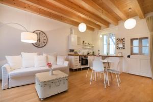 a living room with a couch and a table at Sunny Apartments Vienna in Vienna