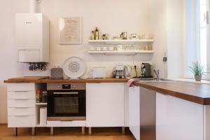 Kuchyň nebo kuchyňský kout v ubytování Sunny Apartments Vienna