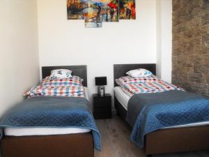 Posteľ alebo postele v izbe v ubytovaní Apartamenty A&B Gold