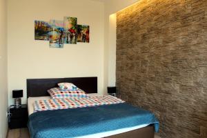 Posteľ alebo postele v izbe v ubytovaní Apartamenty A&B Gold