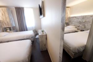 Postel nebo postele na pokoji v ubytování Il Piccolo Mondo