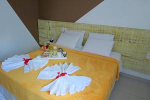 Postel nebo postele na pokoji v ubytování Hotel Encantos de Penedo Alagoas