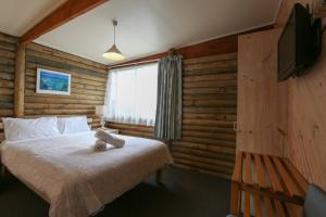 TV i/ili zabavni centar u objektu Lazy Acre Log Cabins