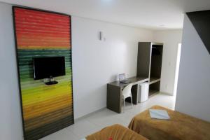 TV a/nebo společenská místnost v ubytování Hotel Encantos de Penedo Alagoas