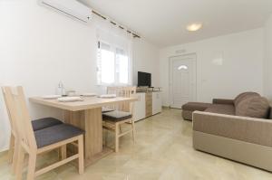 TV a/nebo společenská místnost v ubytování Apartments New home